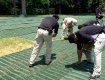 GrassProtecta grass reinforcement mesh being installed for temporary parking in Houston